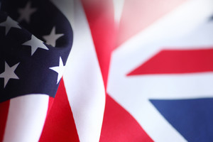 Draped United States flag next to British flag